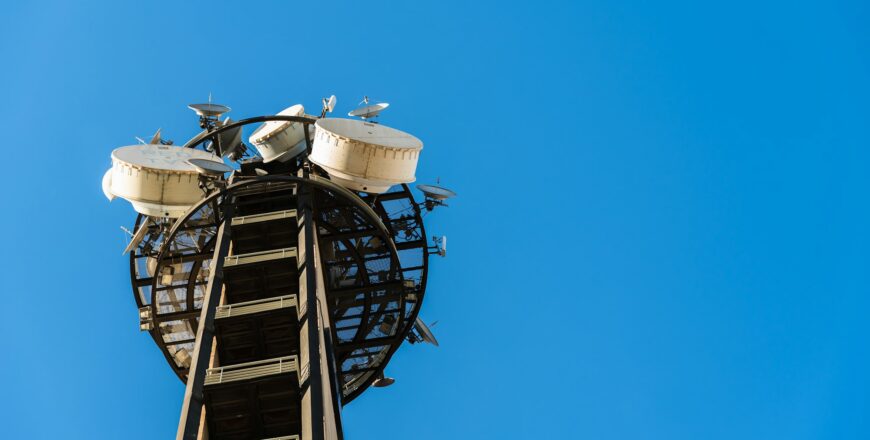 Large telecommunications tower full of radio and television broadcast antennas.