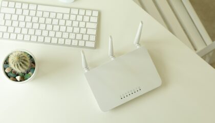 Workplace with Wi - fi router on white table